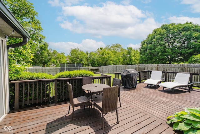 293 E Quail Wood Ln, Westfield, IN 46074 - deck featuring grilling area, outdoor dining space, and a fenced backyard