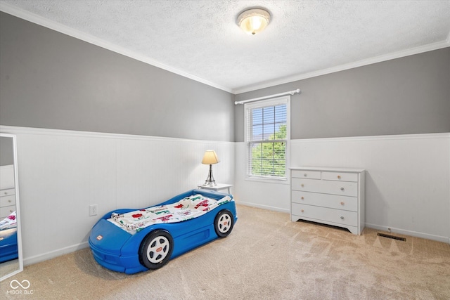 15515 Alameda Pl, Westfield, IN 46074 - bedroom with a textured ceiling, carpet flooring, ornamental molding, and wainscoting