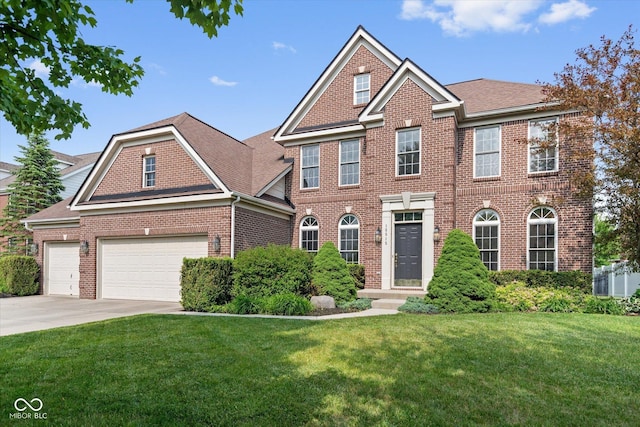 15515 Alameda Pl, Westfield, IN 46074 - colonial-style house with brick siding, driveway, a front yard, and roof with shingles