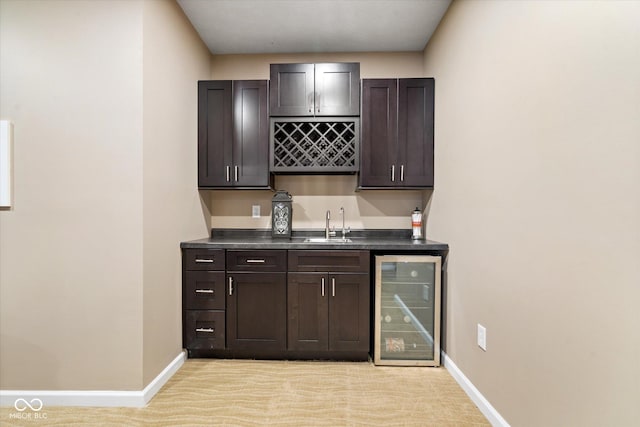 15515 Alameda Pl, Westfield, IN 46074 - indoor wet bar with beverage cooler, baseboards, and light colored carpet