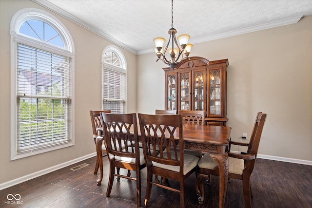 15515 Alameda Pl, Westfield, IN 46074 - dining space with a chandelier, a textured ceiling, ornamental molding, baseboards, and dark wood-style flooring