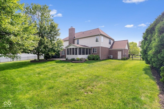 15515 Alameda Pl, Westfield, IN 46074 - back of house featuring a chimney, a sunroom, and brick siding