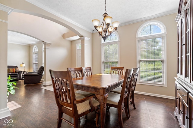 15515 Alameda Pl, Westfield, IN 46074 - dining area with arched walkways, ornate columns, dark wood-style floors, a textured ceiling, and a chandelier