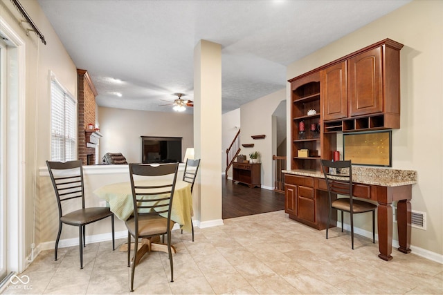 15515 Alameda Pl, Westfield, IN 46074 - dining room featuring a ceiling fan, stairway, and baseboards