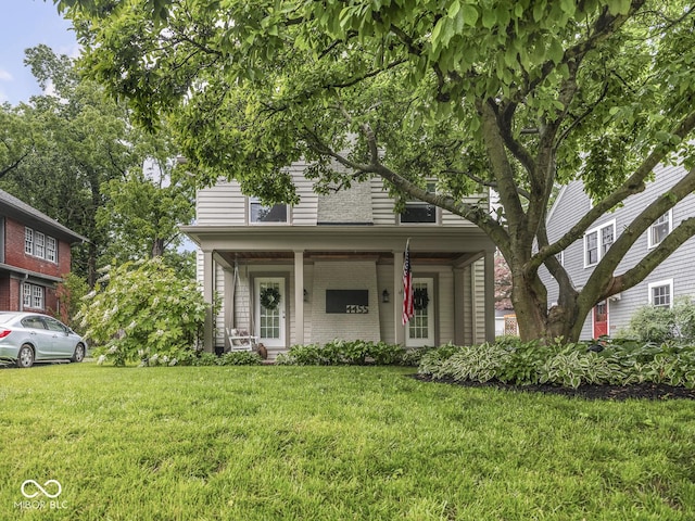 4455 Central Ave, Indianapolis, IN 46205 - view of front of house with a front lawn and a porch
