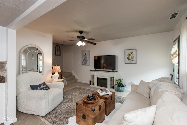 2766 Del Prado Dr Unit 6, Indianapolis, IN 46227 - living area featuring a fireplace, ceiling fan, and carpet flooring