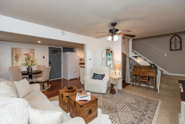 2766 Del Prado Dr Unit 6, Indianapolis, IN 46227 - living area with stairs, ceiling fan, and a textured ceiling