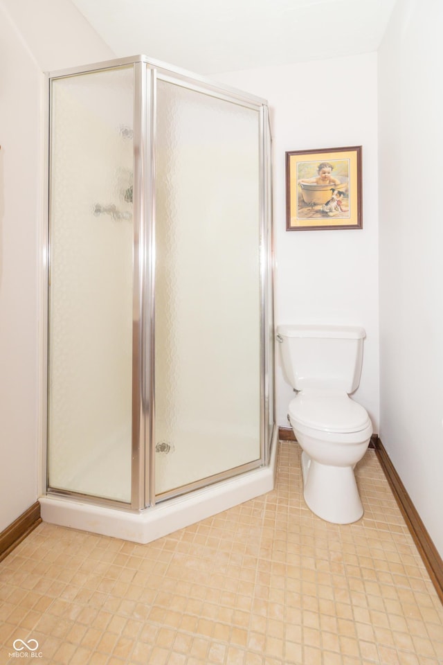 12014 Briar Way Center Dr, Indianapolis, IN 46126 - full bathroom featuring toilet, a shower stall, and baseboards