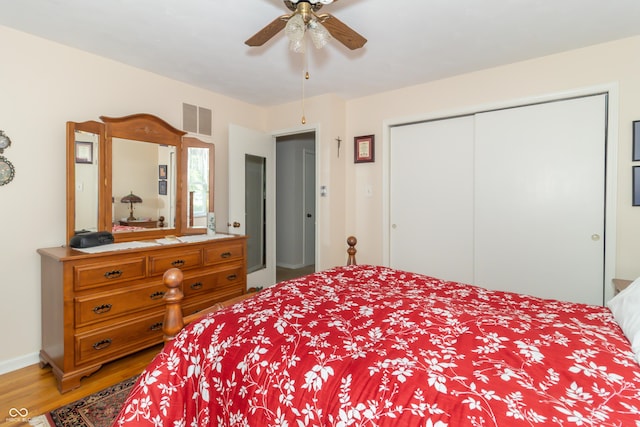 12014 Briar Way Center Dr, Indianapolis, IN 46126 - bedroom featuring light wood-style floors, a closet, and ceiling fan