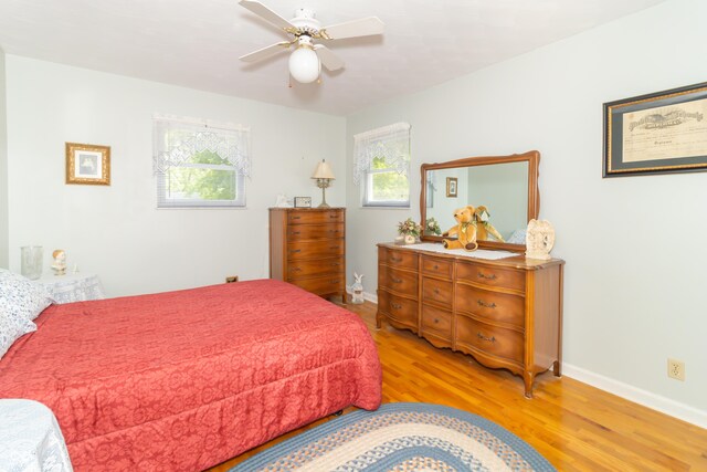 12014 Briar Way Center Dr, Indianapolis, IN 46126 - bedroom featuring light wood finished floors, baseboards, and ceiling fan