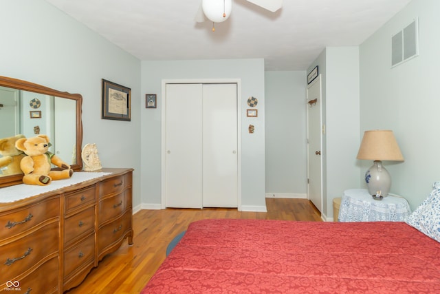 12014 Briar Way Center Dr, Indianapolis, IN 46126 - bedroom featuring light wood-style floors, baseboards, ceiling fan, and a closet