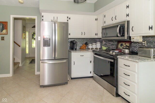 12014 Briar Way Center Dr, Indianapolis, IN 46126 - kitchen with stainless steel appliances, decorative backsplash, and white cabinetry