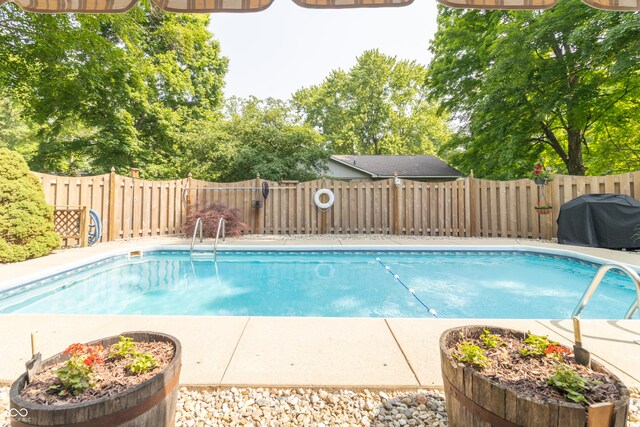 12014 Briar Way Center Dr, Indianapolis, IN 46126 - view of pool with a fenced backyard and grilling area
