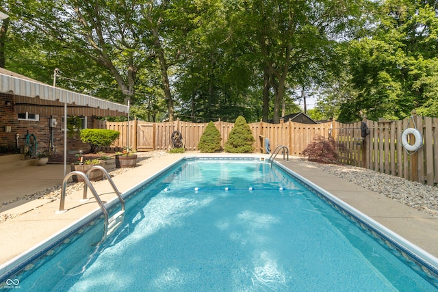 12014 Briar Way Center Dr, Indianapolis, IN 46126 - view of swimming pool with a patio, a fenced backyard, and view of wooded area