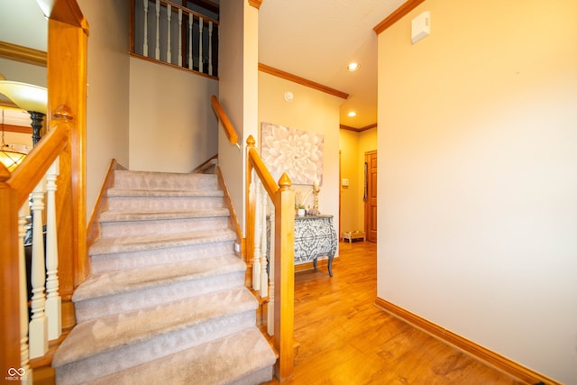 1145 Forest Commons Dr, Avon, IN 46123 - staircase with ornamental molding, wood finished floors, baseboards, and recessed lighting