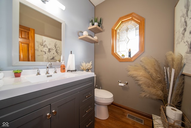 1145 Forest Commons Dr, Avon, IN 46123 - bathroom featuring wood finished floors, toilet, vanity, and baseboards