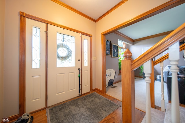 1145 Forest Commons Dr, Avon, IN 46123 - entryway with healthy amount of natural light, crown molding, wood finished floors, and baseboards