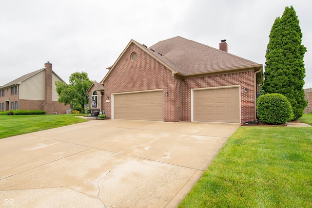 1145 Forest Commons Dr, Avon, IN 46123 - view of front of property with brick siding, an attached garage, driveway, a front yard, and a chimney