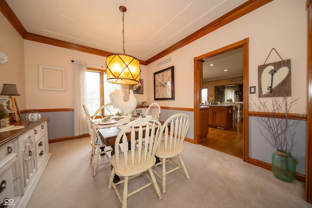 1145 Forest Commons Dr, Avon, IN 46123 - dining space with light carpet, baseboards, crown molding, and a chandelier