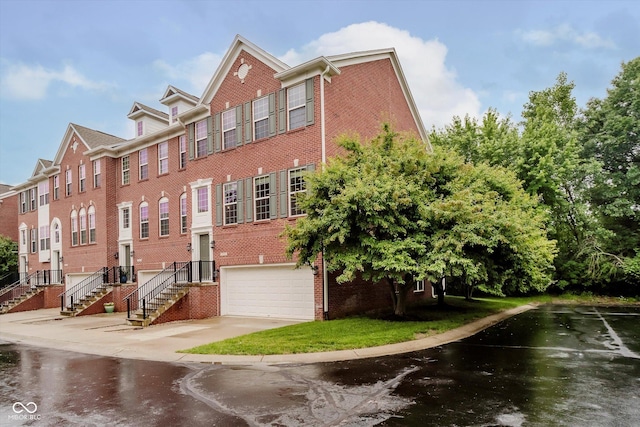 755 Ivy Ln, Carmel, IN 46032 - view of property featuring an attached garage and driveway