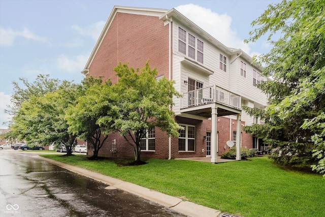 755 Ivy Ln, Carmel, IN 46032 - back of house featuring a lawn, a balcony, and brick siding