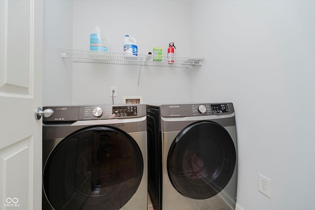 755 Ivy Ln, Carmel, IN 46032 - laundry room featuring independent washer and dryer and light tile patterned floors