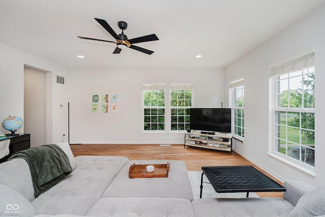 755 Ivy Ln, Carmel, IN 46032 - living area featuring plenty of natural light, wood finished floors, a ceiling fan, and recessed lighting