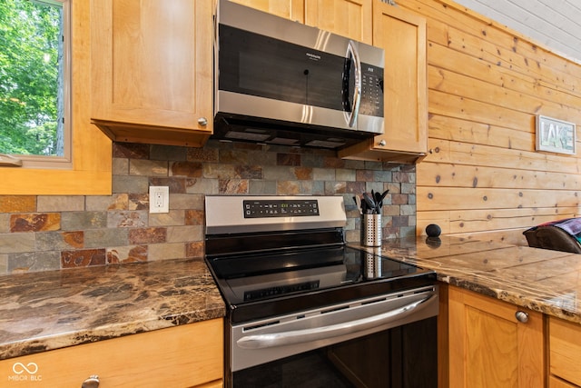 2540 S Annapolis Rd, Rockville, IN 47872 - kitchen with appliances with stainless steel finishes, tasteful backsplash, plenty of natural light, and dark stone countertops