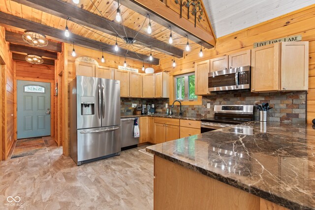 2540 S Annapolis Rd, Rockville, IN 47872 - kitchen with appliances with stainless steel finishes, wooden walls, decorative backsplash, light brown cabinetry, and dark stone countertops