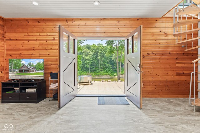 2540 S Annapolis Rd, Rockville, IN 47872 - doorway to outside featuring stairway, wooden walls, concrete flooring, and recessed lighting