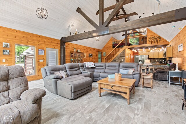 2540 S Annapolis Rd, Rockville, IN 47872 - living area featuring wooden walls, a chandelier, stairs, and light marble finish floors
