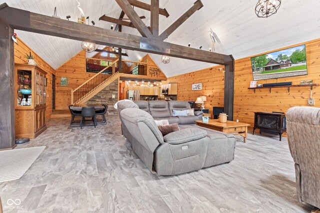 2540 S Annapolis Rd, Rockville, IN 47872 - living area with wooden walls, stairway, and a wood stove