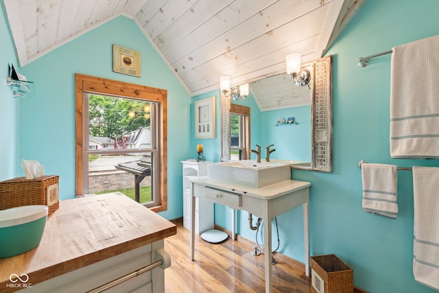 2540 S Annapolis Rd, Rockville, IN 47872 - bathroom featuring vaulted ceiling, wood finished floors, and vanity