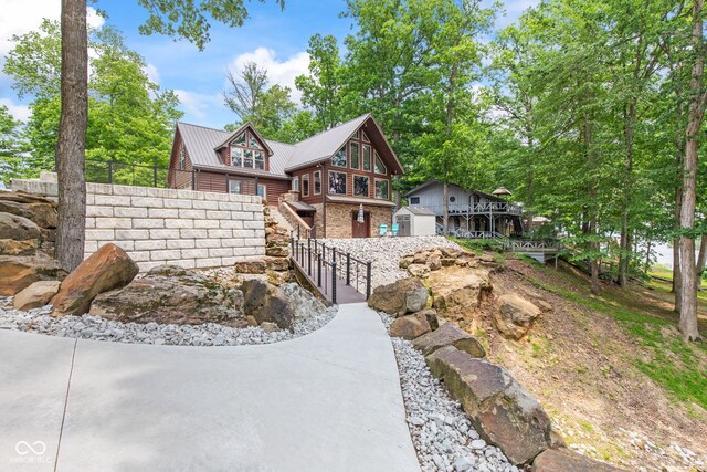 2540 S Annapolis Rd, Rockville, IN 47872 - chalet / cabin featuring metal roof, stairway, and an outdoor structure