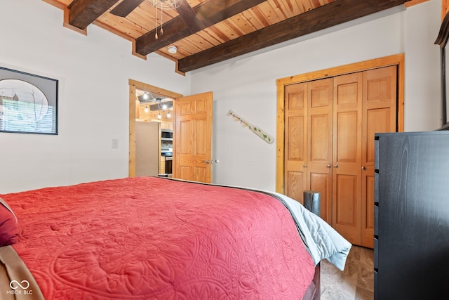2540 S Annapolis Rd, Rockville, IN 47872 - bedroom featuring wood finished floors, wood ceiling with exposed beams, a closet, and a ceiling fan
