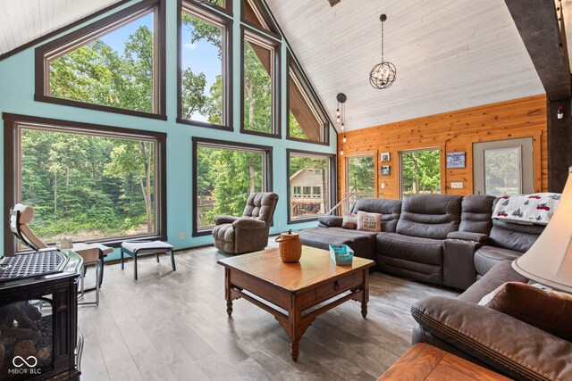 2540 S Annapolis Rd, Rockville, IN 47872 - living room with high vaulted ceiling, a chandelier, wooden walls, wooden ceiling, and wood finished floors