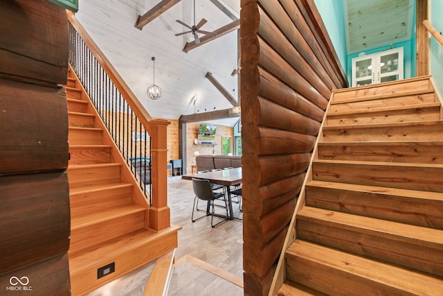2540 S Annapolis Rd, Rockville, IN 47872 - stairway featuring ceiling fan, a towering ceiling, and log walls