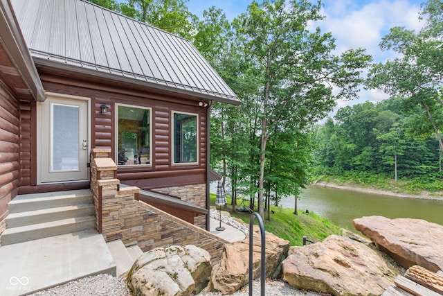 2540 S Annapolis Rd, Rockville, IN 47872 - view of exterior entry with a standing seam roof, metal roof, and a water view