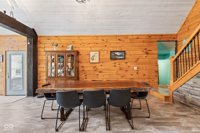 2540 S Annapolis Rd, Rockville, IN 47872 - dining area with unfinished concrete flooring, wood walls, stairway, and lofted ceiling