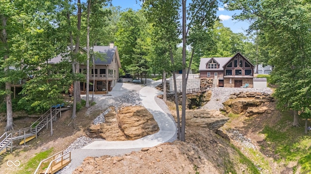 2540 S Annapolis Rd, Rockville, IN 47872 - rear view of house featuring stairway, a chimney, and view of wooded area