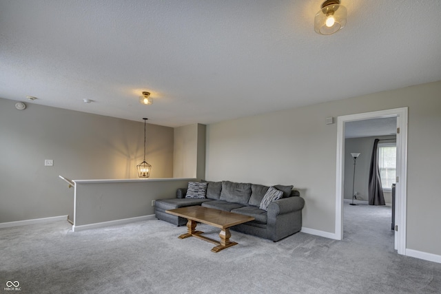 19187 Outer Bank Rd, Noblesville, IN 46062 - living area featuring light colored carpet, baseboards, and a textured ceiling