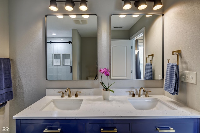 19187 Outer Bank Rd, Noblesville, IN 46062 - bathroom featuring double vanity and a textured wall