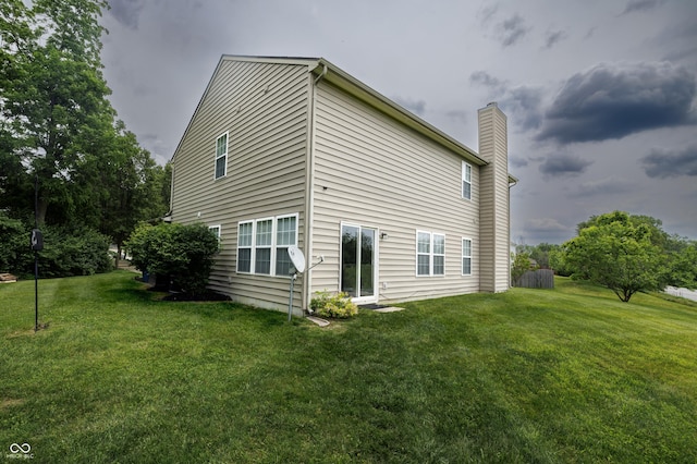 19187 Outer Bank Rd, Noblesville, IN 46062 - view of home's exterior with a chimney and a yard