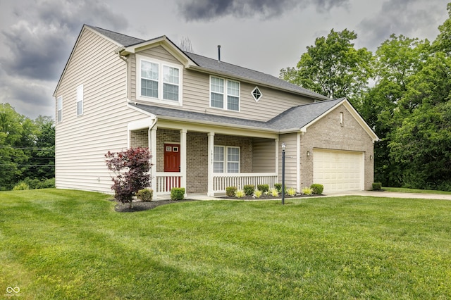 19187 Outer Bank Rd, Noblesville, IN 46062 - view of front facade featuring covered porch, a garage, brick siding, driveway, and a front yard