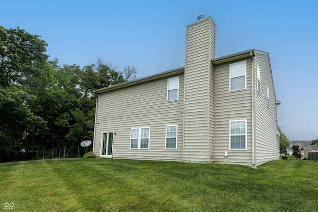 19187 Outer Bank Rd, Noblesville, IN 46062 - rear view of property featuring a chimney and a lawn