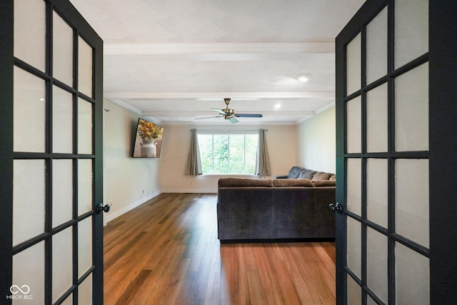 955 Wood Creek Pl, Greenwood, IN 46142 - unfurnished living room with ornamental molding, wood finished floors, ceiling fan, baseboards, and beam ceiling