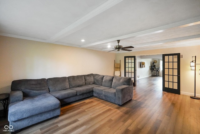 955 Wood Creek Pl, Greenwood, IN 46142 - living room with wood finished floors, french doors, beam ceiling, ornamental molding, and baseboards