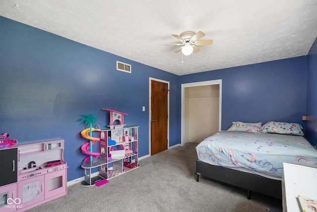 955 Wood Creek Pl, Greenwood, IN 46142 - carpeted bedroom with a textured ceiling, ceiling fan, and baseboards