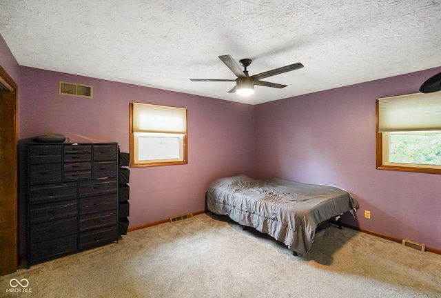 955 Wood Creek Pl, Greenwood, IN 46142 - bedroom featuring carpet flooring, baseboards, a textured ceiling, and a ceiling fan