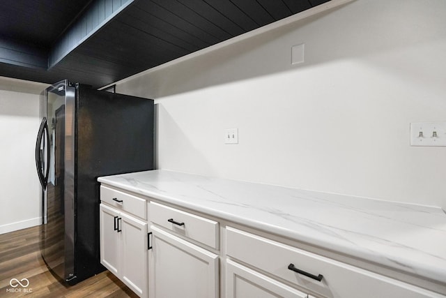 955 Wood Creek Pl, Greenwood, IN 46142 - detailed view of freestanding refrigerator and wood finished floors